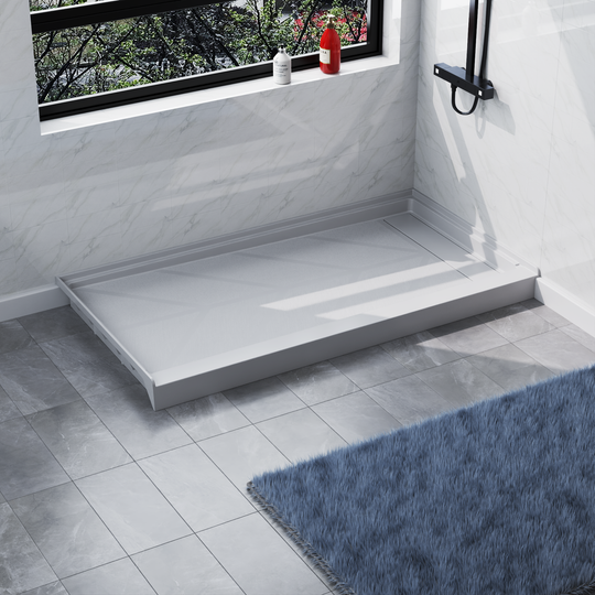 Angled view of 60'' x 32'' white SMC shower base with right linear drain and gloss finish, installed in modern bathroom with marble walls#right_white