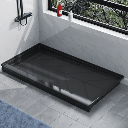Angled view of black SMC shower base with left linear drain and gloss finish, installed in modern bathroom with marble walls and gray floor tiles#color_black#drain_left